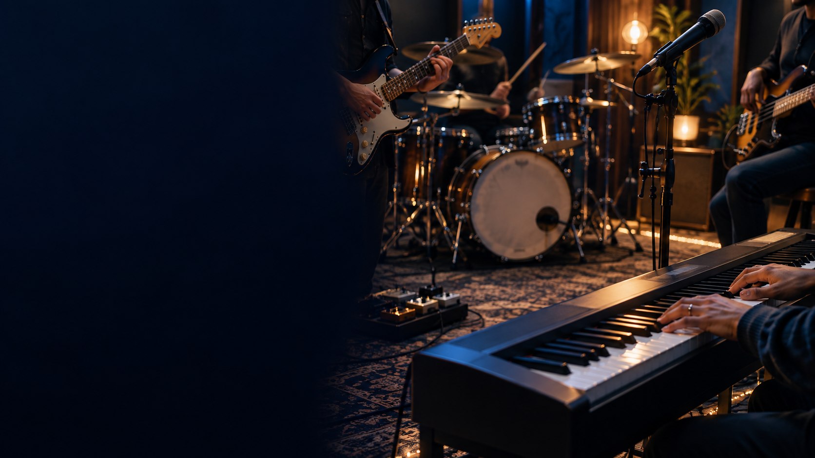 Guitar, bass, drums, microphone, and keyboard in a rehearsal studio